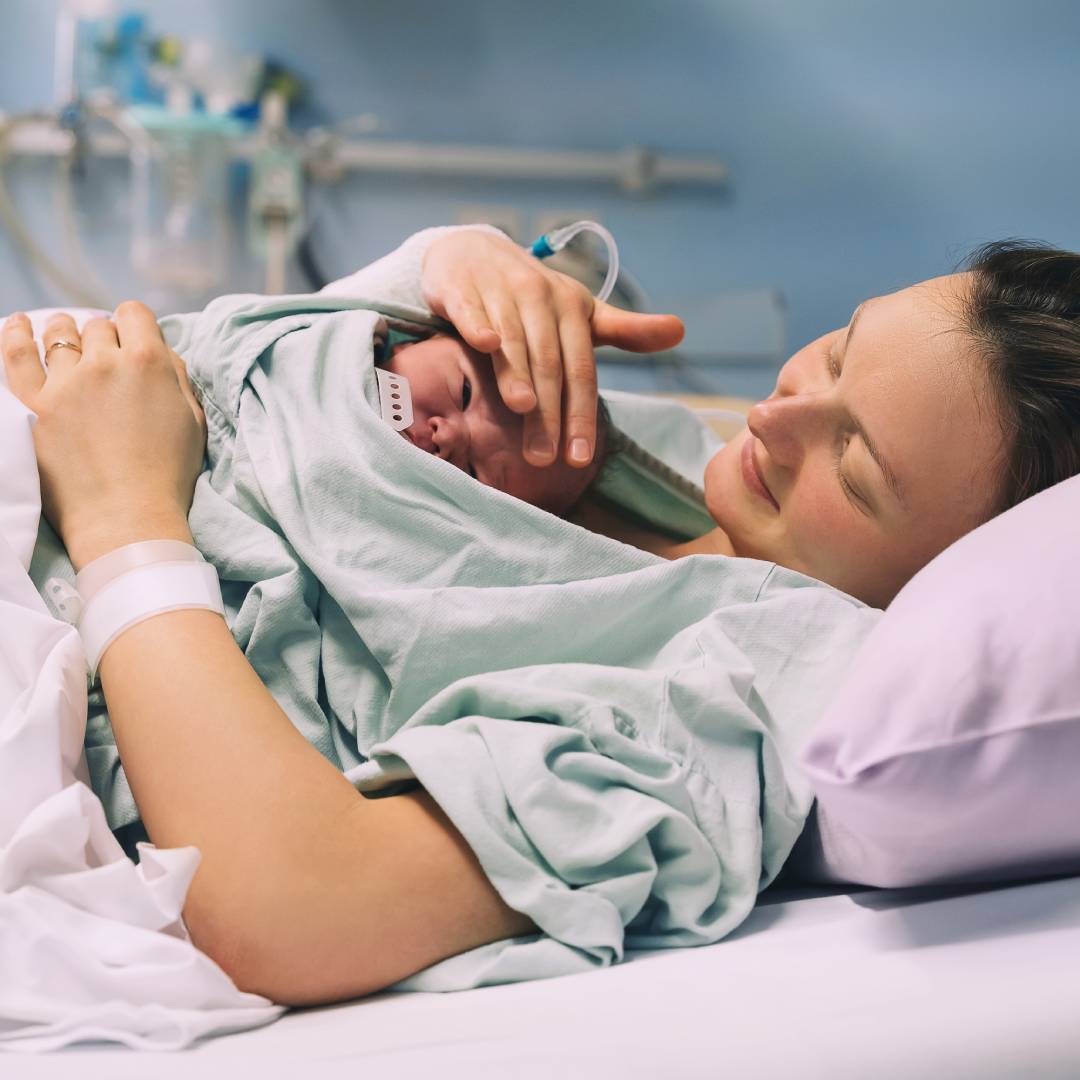 New mother enjoying cuddles with her newborn